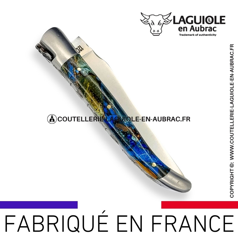 couteau laguiole en aubrac pliant aux doubles platines "fusion ivoire bleu" finition brillante